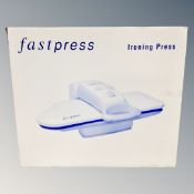 A Fastpress ironing press, boxed.