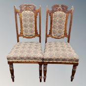 A pair of Edwardian stained beech high backed dining chairs
