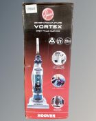 A Hoover Vortex upright vacuum, boxed.