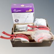A box containing a Light N Easy floor steam cleaner, boxed,