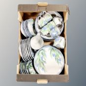 A box containing a quantity of Highland stoneware tea and dinnerware.
