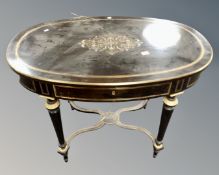 A 19th century French ebonised and brass inlaid oval table,
