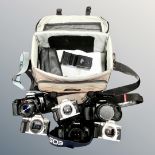 A camera bag containing assorted Minolta, Pentax and Canon cameras including Canon EOS 1000F,