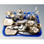 A tray containing a three piece plated tea service,