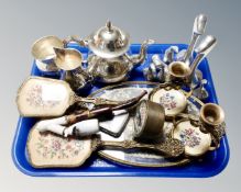 A tray containing a three piece plated tea service,