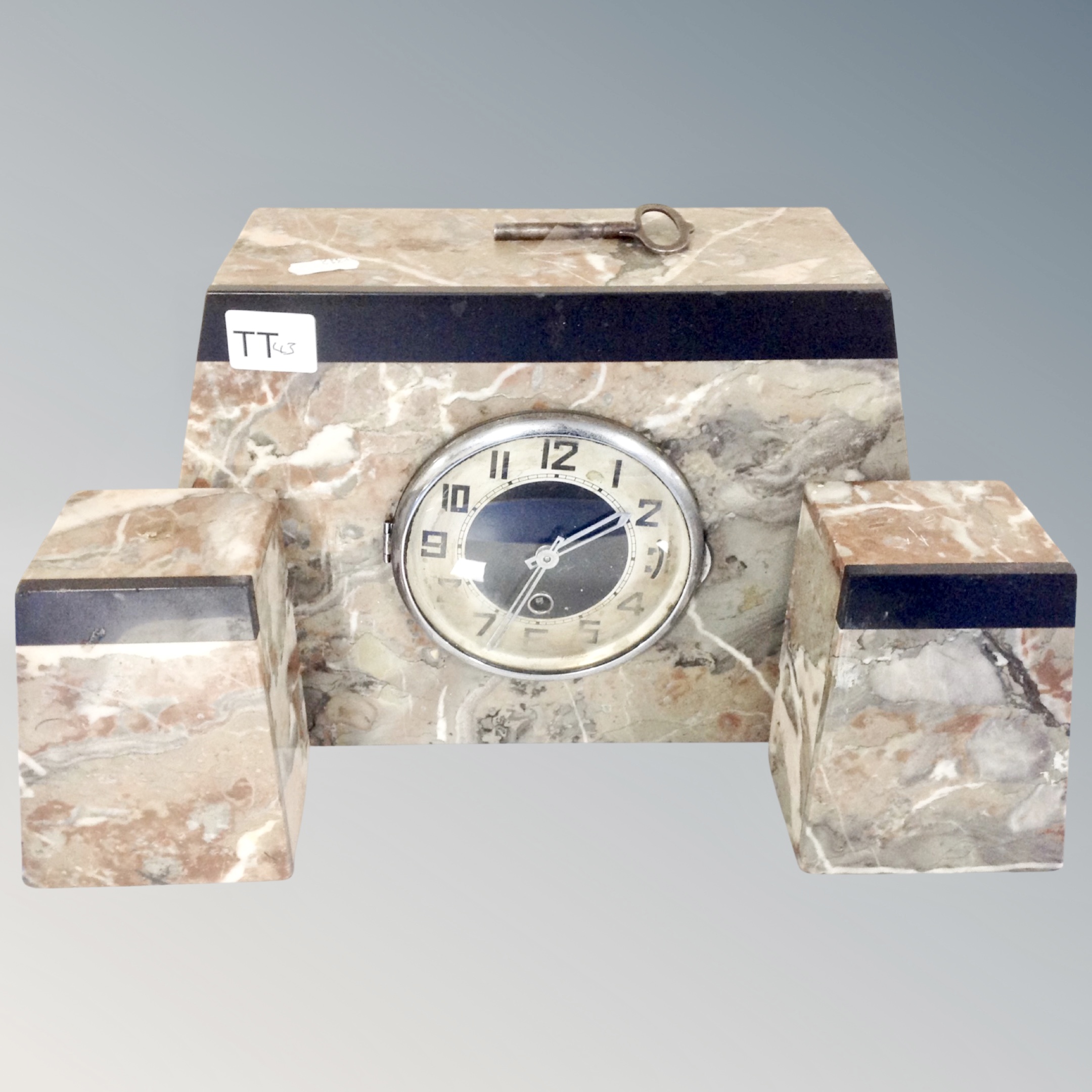 A three piece Art Deco marble clock set.