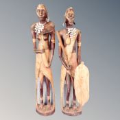 A pair of carved wooden tribal figures