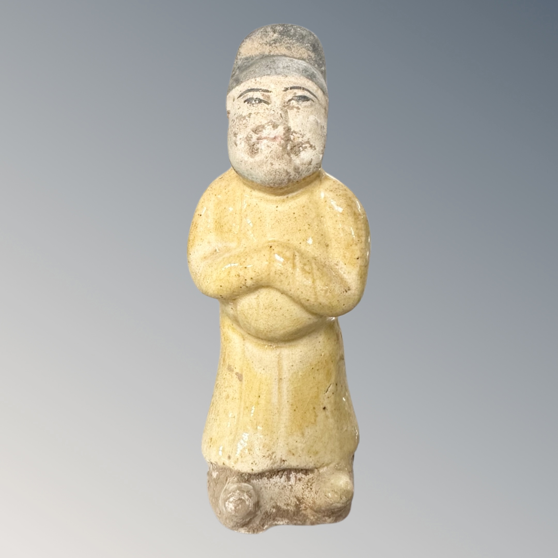 A Chinese Tang dynasty glazed pottery figure, height 12 cm.