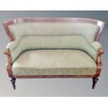 A 19th century inlaid mahogany three seater settee upholstered in tow tone green fabric.