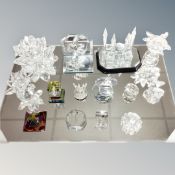 A tray containing assorted crystal ornaments and paperweights together with a mirrored stand.