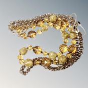 An 18ct gold plated footprint together with a Joan Rivers glass bead necklace,