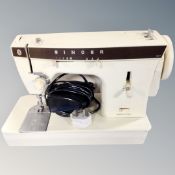 A Singer 367 electric sewing machine with foot pedal.