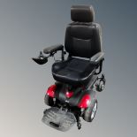 A Drive Titan Powerchair electric wheelchair with charger