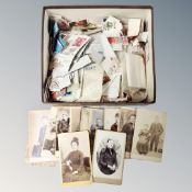 A box of stamps together with approximately 14 carded Edwardian and Victorian photographs.
