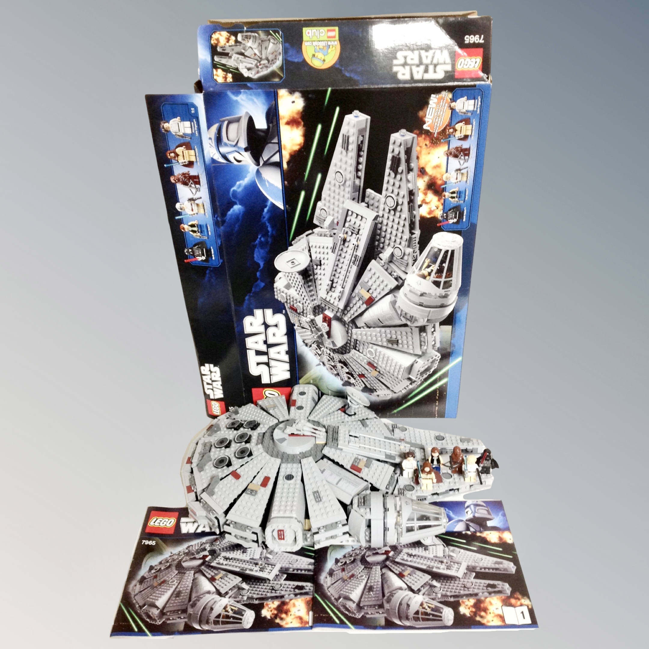 A Lego Star Wars 7965 Millenium Falcon, with box and instructions.