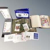 A box containing a Herald stamp album containing antique and later stamps,
