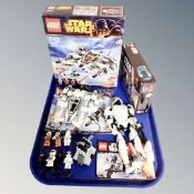 A Lego Star Wars 75049 Snow Speeder together with a Lego Star Wars 75132 First Order Battlepack,
