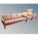A Scandinavian three piece tan leather lounge suite comprising of a three seater settee (width