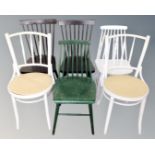 Seven assorted painted dining room chairs.