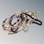 A collection of nine assorted bangles and bracelets including Halcyon Days, French jet,