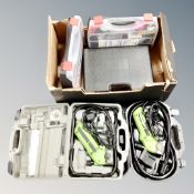 Three cased power tools including two Exact saws, a cased 12v electric drill with battery,