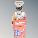 A Rug Doctor deep carpet cleaner with box