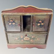 A hand painted countertop fall front cabinet fitted with two cupboards.