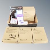 A box containing Homedics neck and shoulder massager, Homedics UV clean portable sanitiser bag,