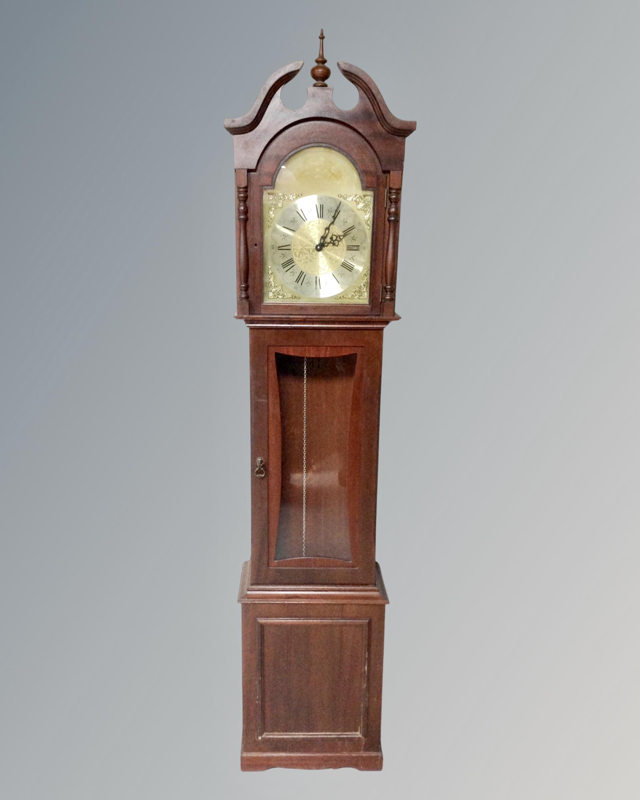 A Tempus Fugit longcase clock.