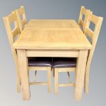 Oakland Furniture : A contemporary oak extending dining table with leaf and four ladder back chairs