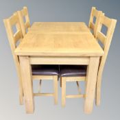 Oakland Furniture : A contemporary oak extending dining table with leaf and four ladder back chairs