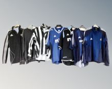 Three early 20th century Adidas replica away shirts together with a retro style football top,