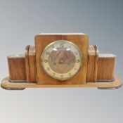 An early 20th century walnut Art Deco style mantel clock.