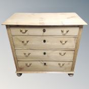 A 19th century pine four drawer chest with brass drop handles.
