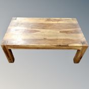A sheesham wood coffee table.
