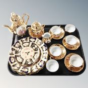 A tray containing a continental gilded coffee set, Imari patterned plates.