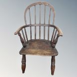 A 19th century child's Windsor armchair.