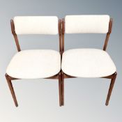 A pair of Danish Oddense Maskinsnedkeri teak dining chairs designed by Erik Buch