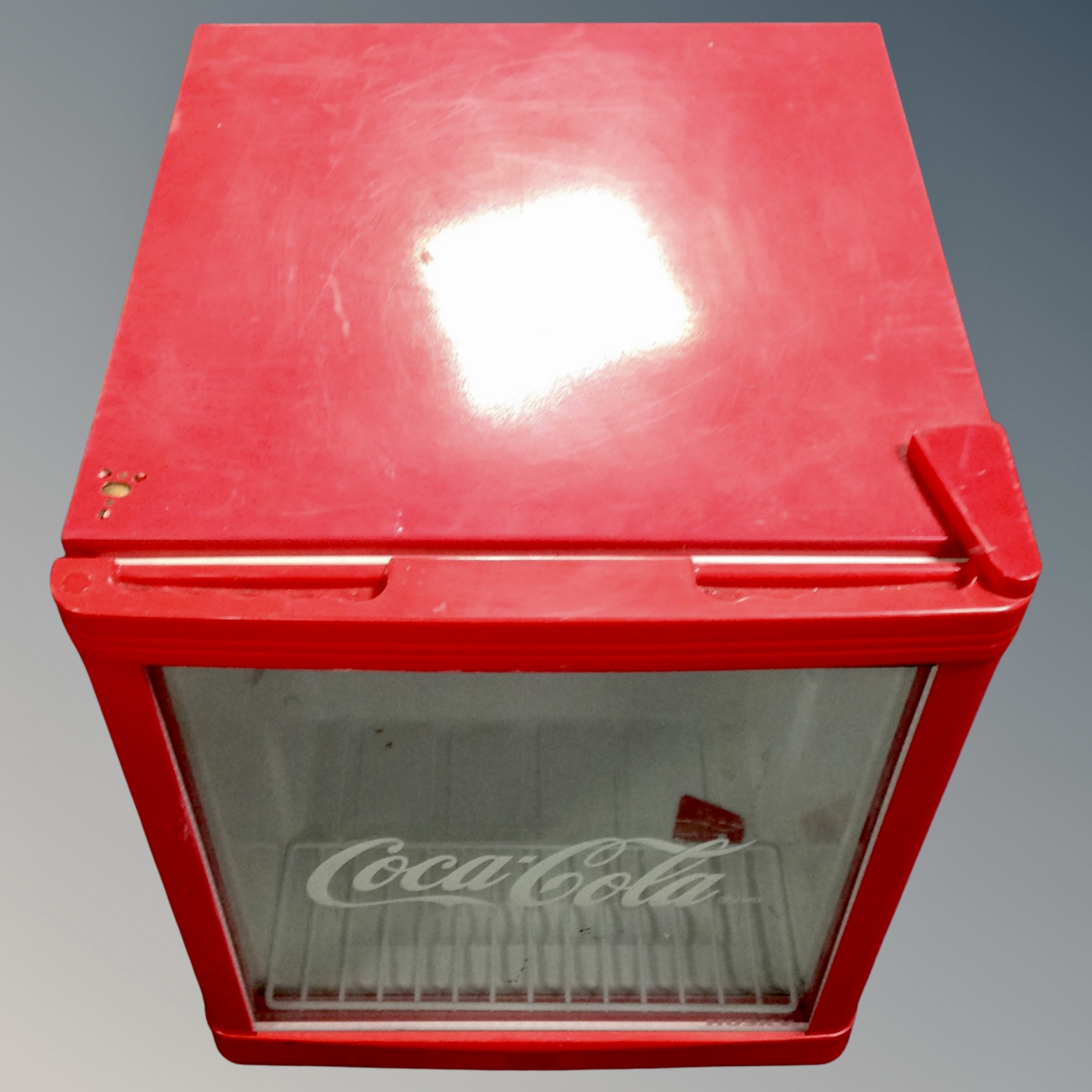 A Coca-Cola bottle fridge.