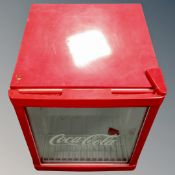 A Coca-Cola bottle fridge.