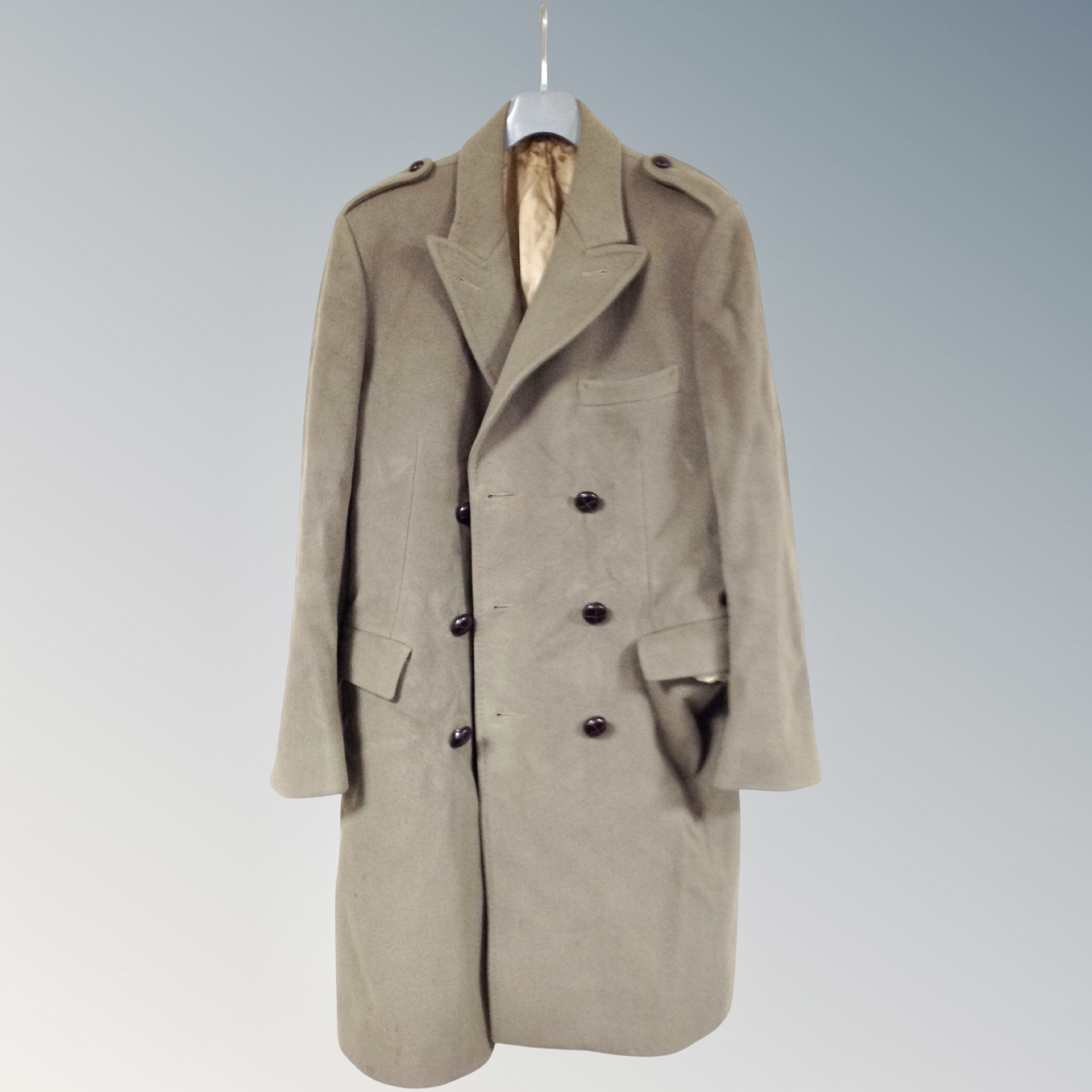 An early 20th century white mink coat together with a wool Crombie coat.