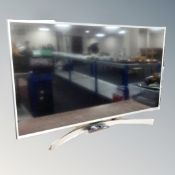 An LG 50" LCD TV with remote.