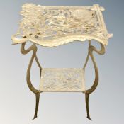 A wrought iron gilded Art Nouveau style two-tier plant stand.