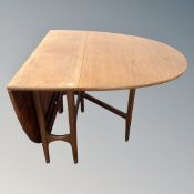 A mid-20th century teak gate leg table.