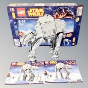 A Lego Star Wars 75054 AT-AT, with minifigures, box and instructions.