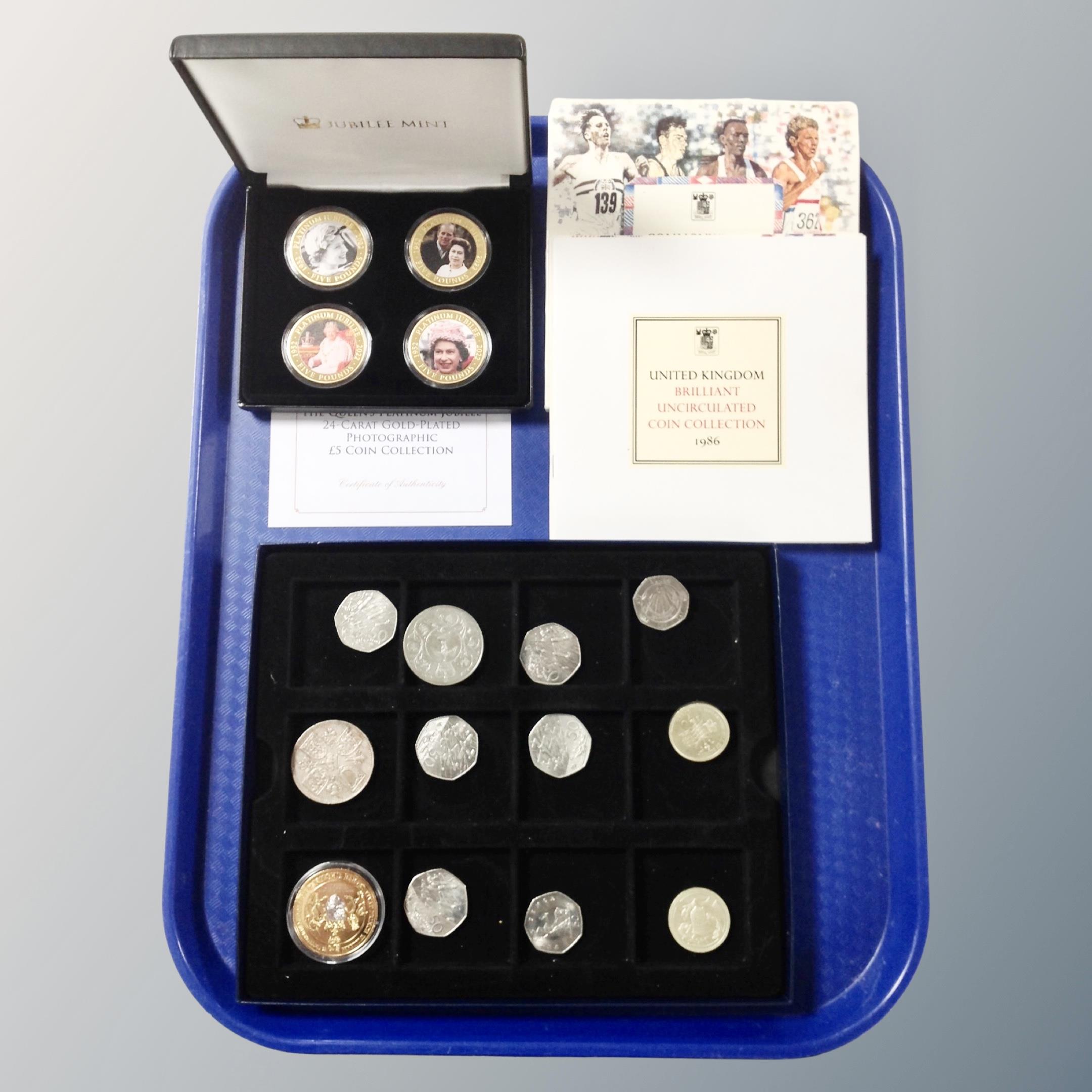 A collection of coins, commemorative jubilee mint, crowns, gold plated coins,