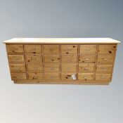 A pine 24 drawer block chest.