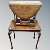 An Edwardian walnut occasional table on claw and ball feet together with a further flap sided