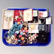 A tray of costume jewellery, beaded necklaces, contemporary pocket watch, magnifying glass etc.