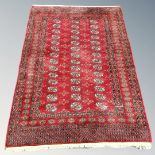 A Tekke rug on claret ground, Afghanistan, 176cm by 131cm.